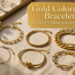A collection of gold-colored bracelets in various styles on a textured surface.