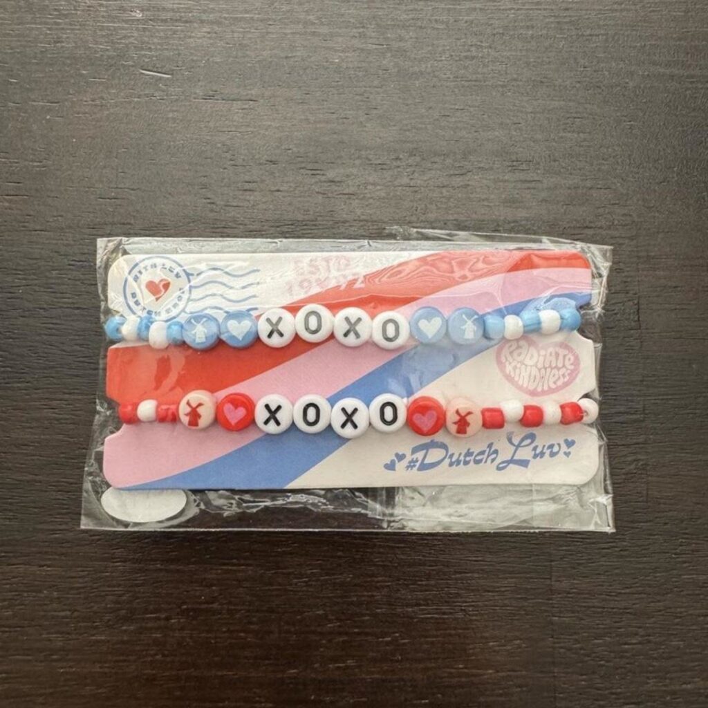 Two beaded bracelets with XOXO letter beads and hearts in a plastic package.
