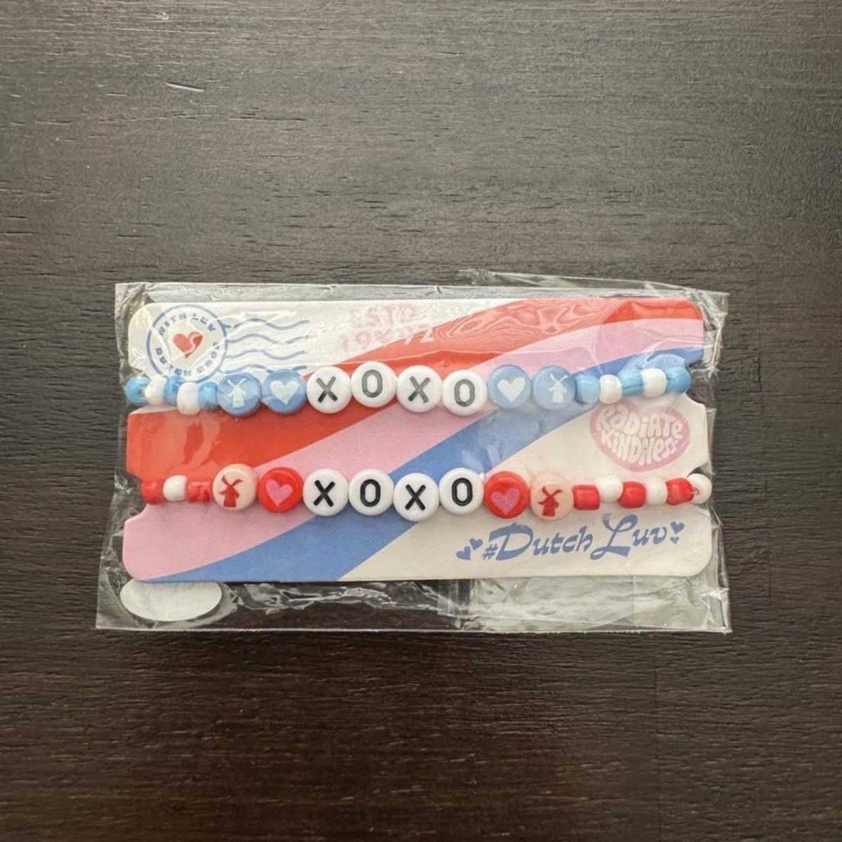 Two beaded bracelets with XOXO letter beads and hearts in a plastic package.